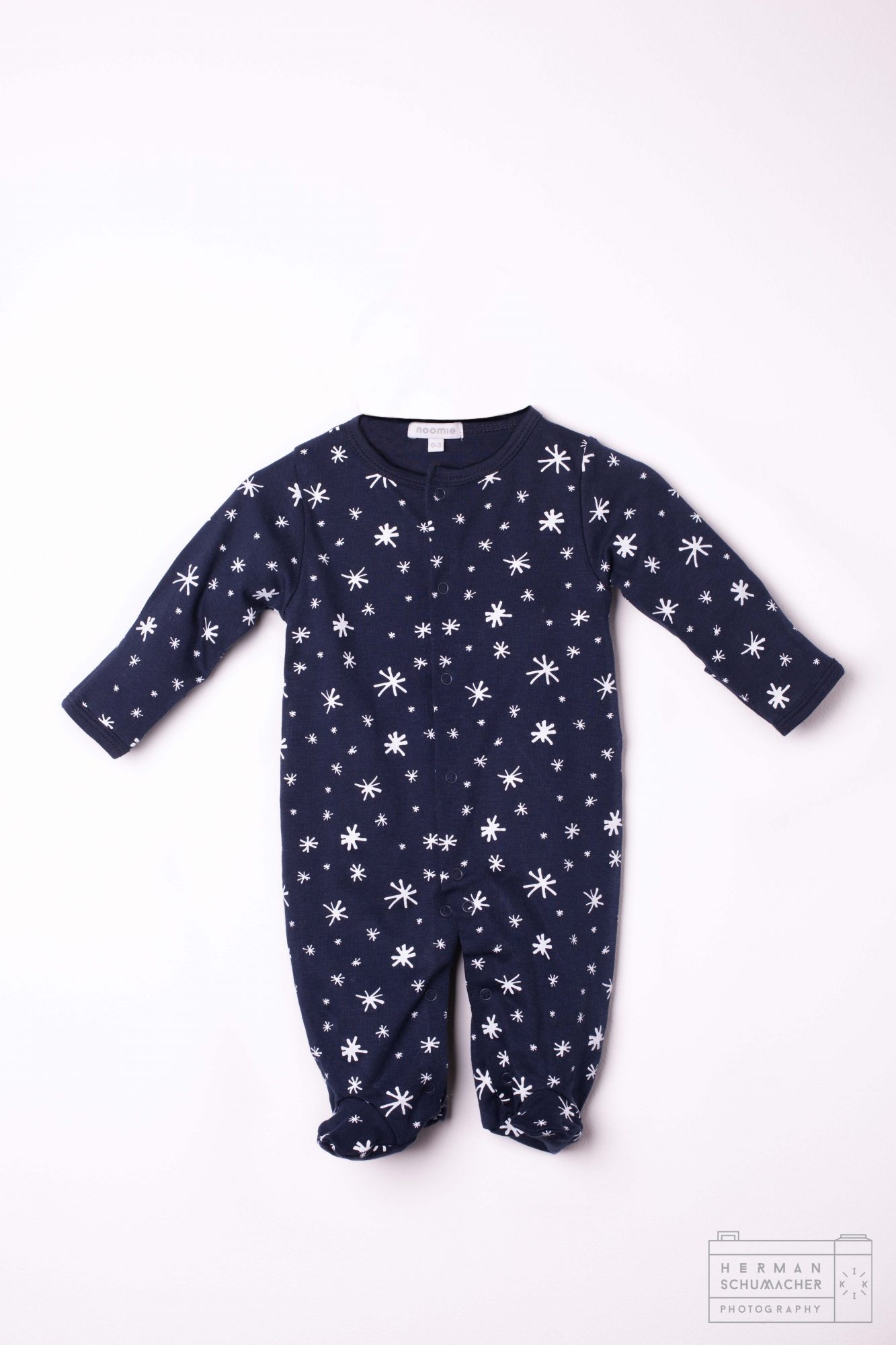 navy blue baby noomie onesie with cats and lions