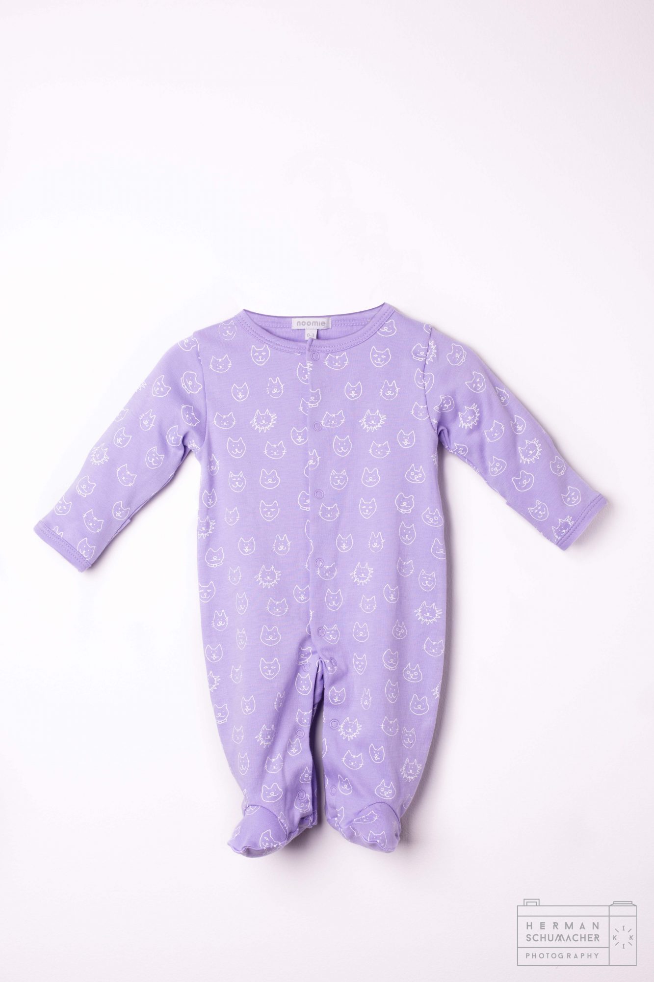 blue baby noomie onesie with cats and lions